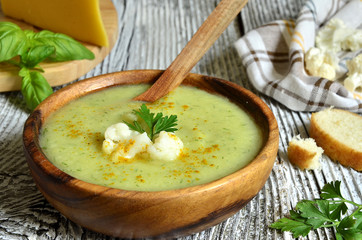 Cauliflower cream soup with cheese,herbs and curry.