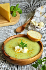 Cauliflower cream soup with cheese,herbs and curry.
