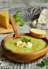 Cauliflower cream soup with cheese,herbs and curry.