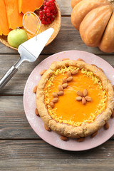 Homemade pumpkin pie on table