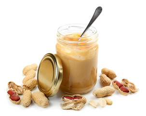 Creamy peanut butter in jar, isolated on white