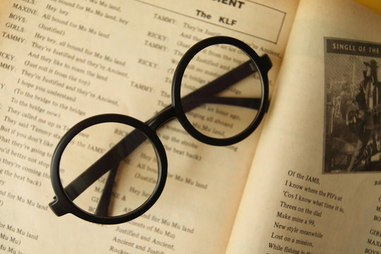 eyeglasses on the open book.