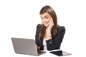 Young business woman working on laptop.