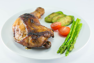 Closeup of roast chicken and vegetables