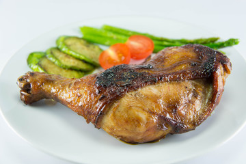 Closeup of roast chicken and vegetables