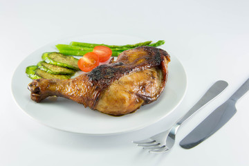 Closeup of roast chicken and vegetables