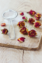 Fototapeta na wymiar Dried rose buds and aromatic icing sugar