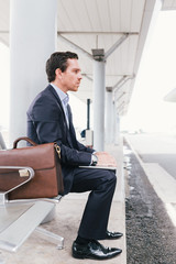 Businessman at bus station