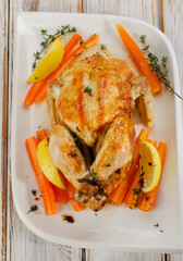 Whole Roasted chicken  on  white plate