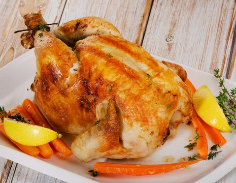 Roasted chicken  on a  white plate