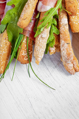 Parma ham prosciutto with grissini bread sticks