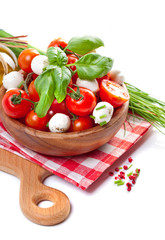 Mozzarella cheese with cherry tomatoes and basil