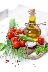 Cherry Tomatoes, chives and peppers on white