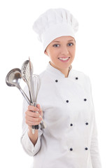 Naklejka premium young woman in chef uniform with kitchen equipment isolated on w