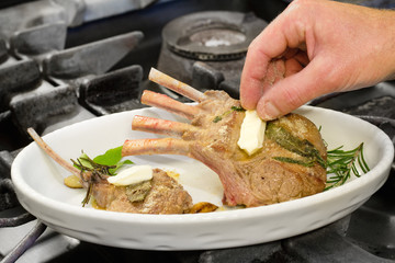 lamb cutlet with herbs ready for the oven