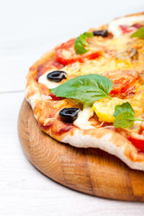 Delicious fresh pizza served on wooden table