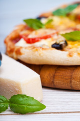 Delicious fresh pizza served on wooden table