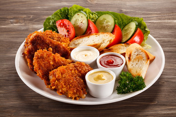 Fried chicken nuggets and vegetables