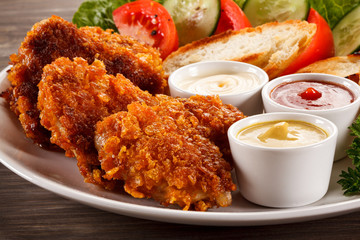 Fried chicken nuggets and vegetables