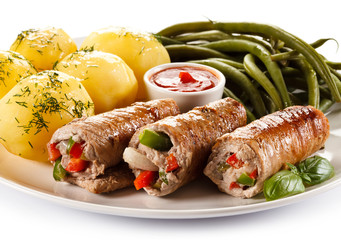 Wrapped pork chop, boiled potatoes and vegetables