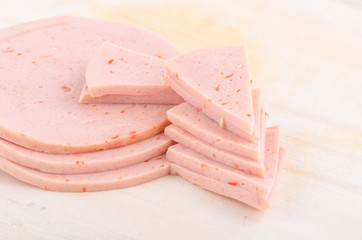 baloney sausage slices isolated on white © Dourleak