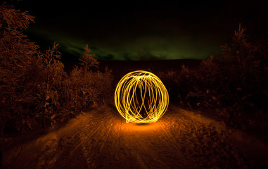fire painting, light painting with sparks at winter - Powered by Adobe