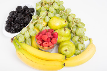 Raspberries Blackberries Grapes Bananas and Pears on White