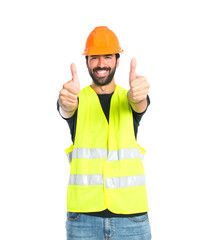 Workman with thumb up over white background