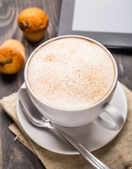 Cappuccino coffee with muffins