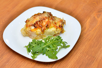 Cod baked with vegetables and cheese