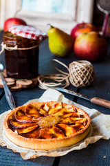 apple tart on a sand base with pear jam and caramel