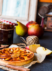 apple tart on a sand base with pear jam and caramel