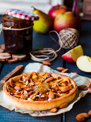 apple tart on a sand base with pear jam and caramel