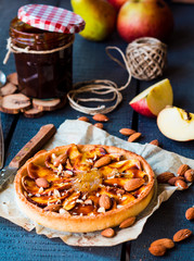apple tart on a sand base with pear jam and caramel