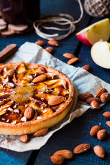 apple tart on a sand base with pear jam and caramel