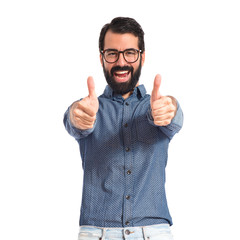Young hipster man with thumb up
