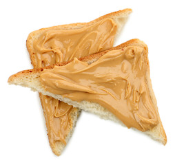 Slices of bread with creamy peanut butter, isolated on white