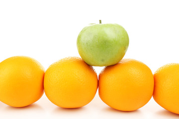 Juicy oranges and green apple, isolated on white