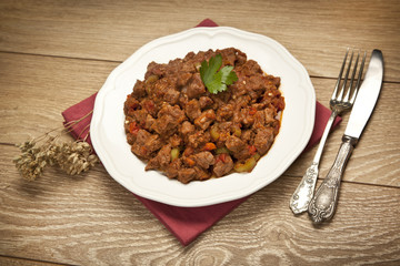 Meat Saute Turkish Et sote with wooden table