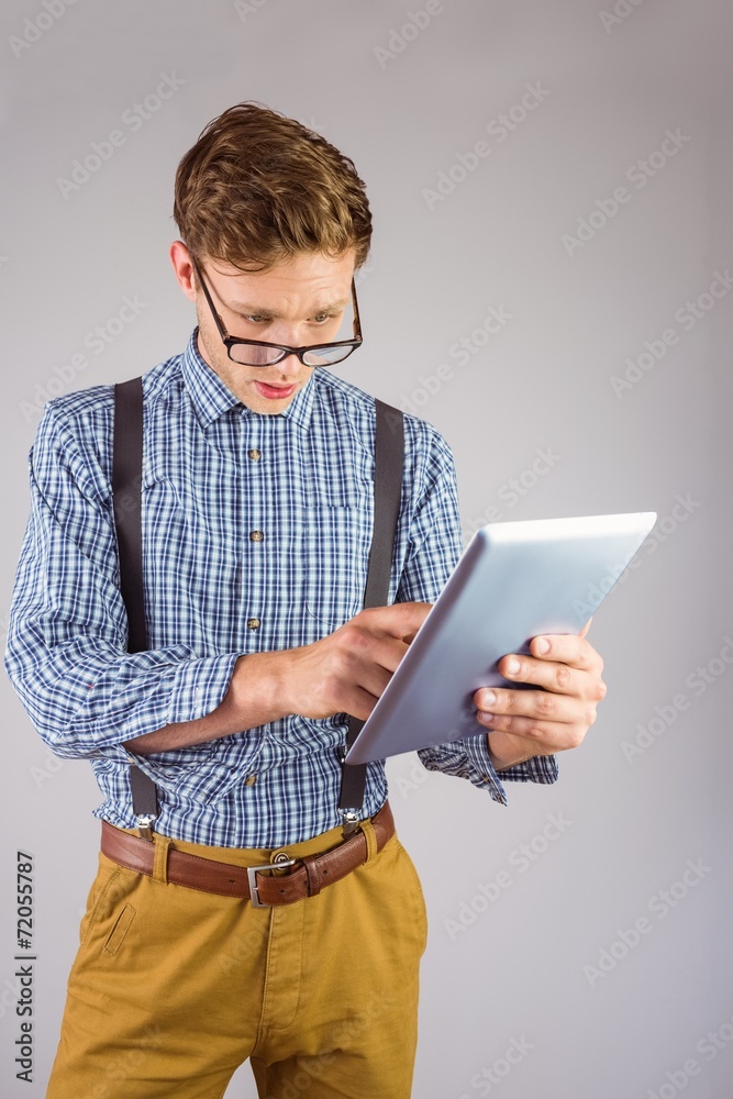 Aufkleber geeky businessman using his tablet pc