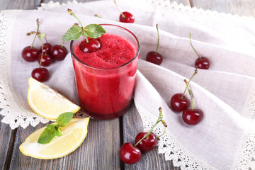 Fresh cold cherry cocktail with mint and lemon