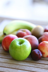 Juicy fruits on wooden table, close-up