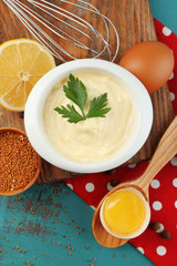 Mayonnaise ingredients on wooden background