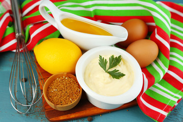 Mayonnaise ingredients on wooden background