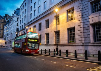 Fototapeta na wymiar Bus on a streets of London at dusk