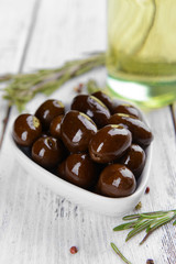 Marinated olives on table close-up