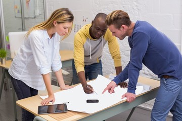 Interior designers looking at blueprint