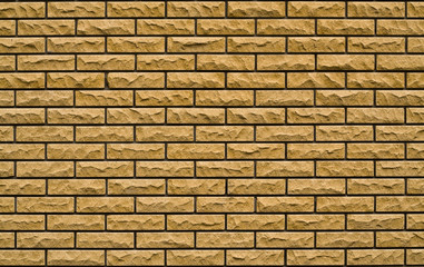 Obraz premium even yellow, rough brick wall