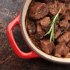 Braised beef in skillet on brown rustic background - 72061585