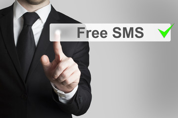 businessman pushing flat touchscreen button free sms